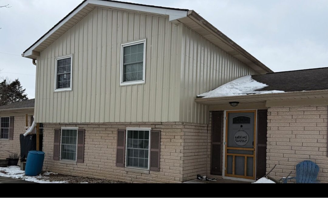 Residential home with light stone MP36 siding combining modern style with durability