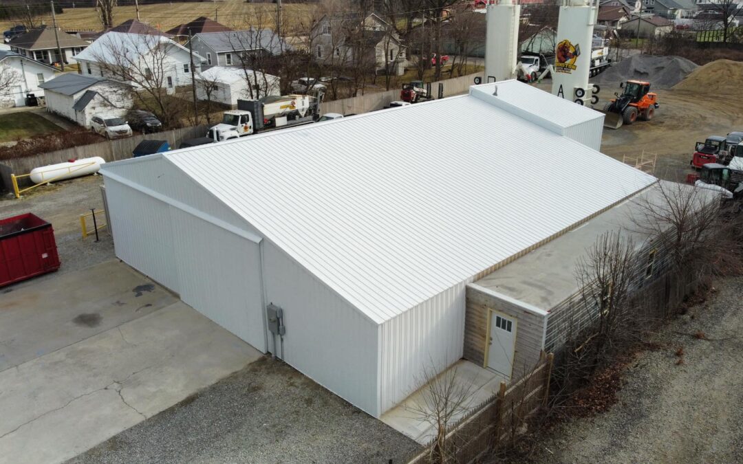 Commercial building clad in white MP36 steel siding panels, showcasing clean, low-maintenance exterior